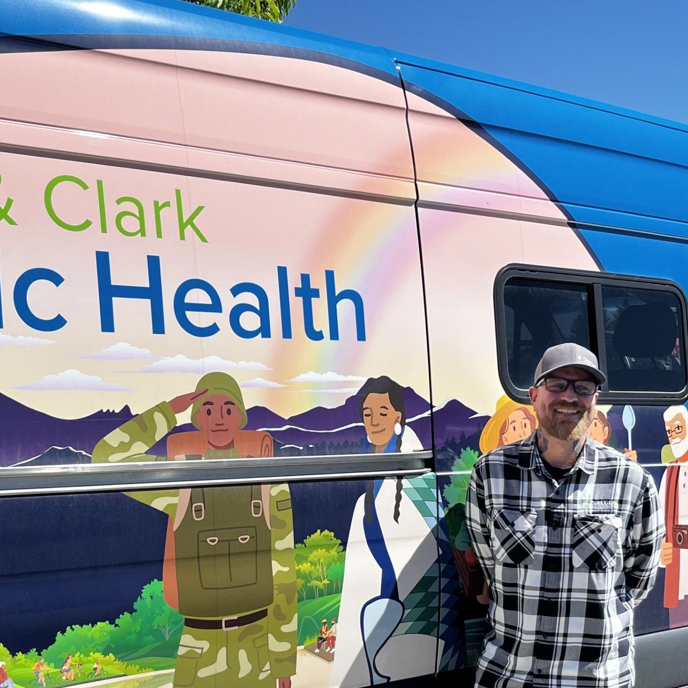 A man standing in front of a van