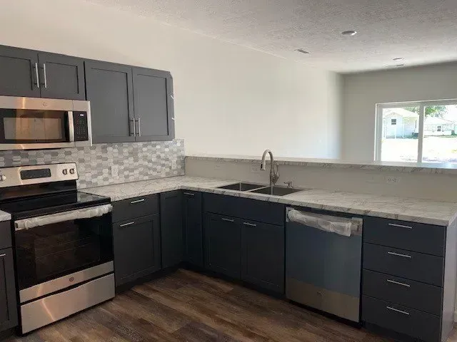 A Kitchen With Stainless Steel — Sioux City, IA — Construction Plus LLC