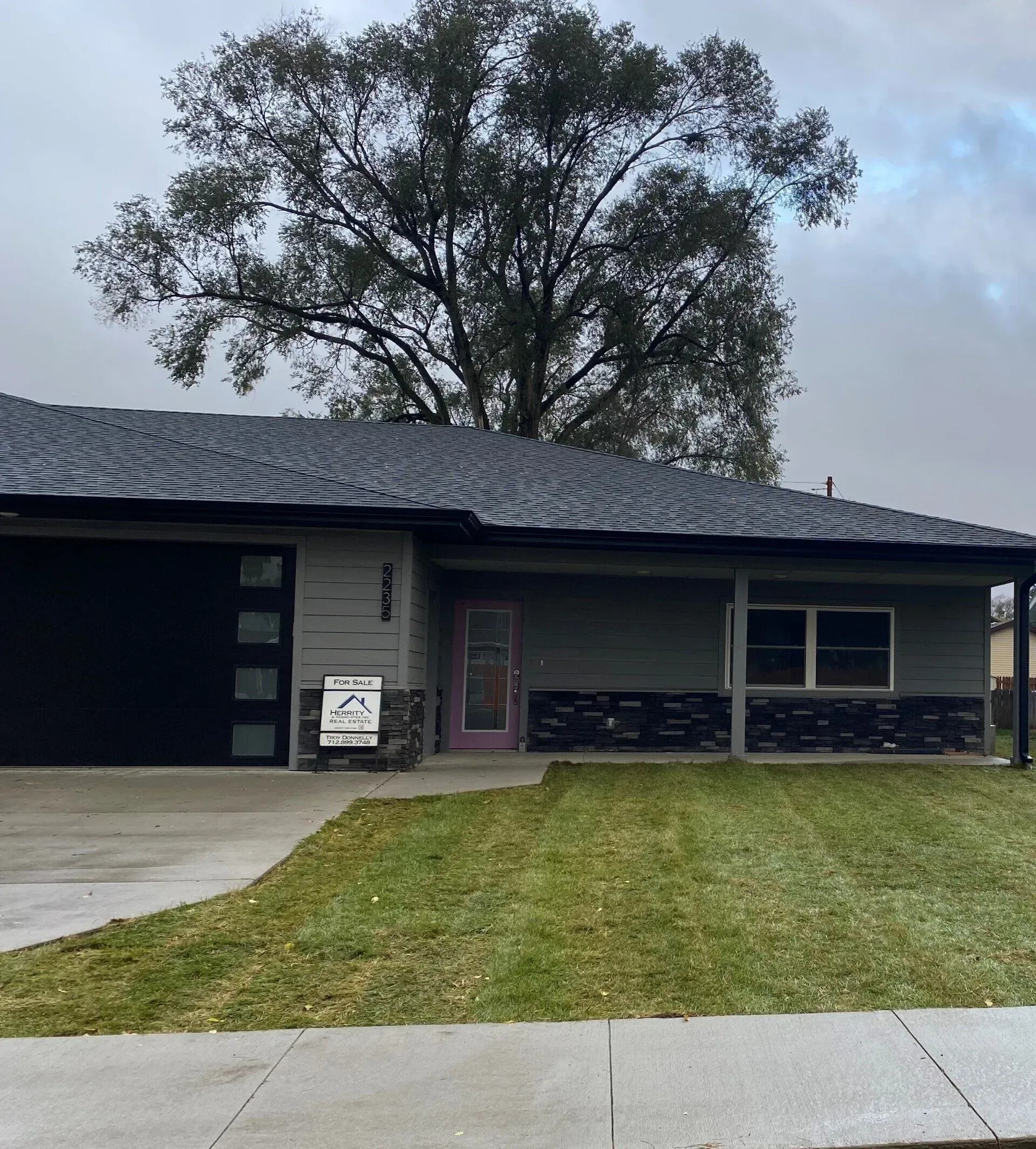 A House With A For Sale Sign — Sioux City, IA — Construction Plus LLC