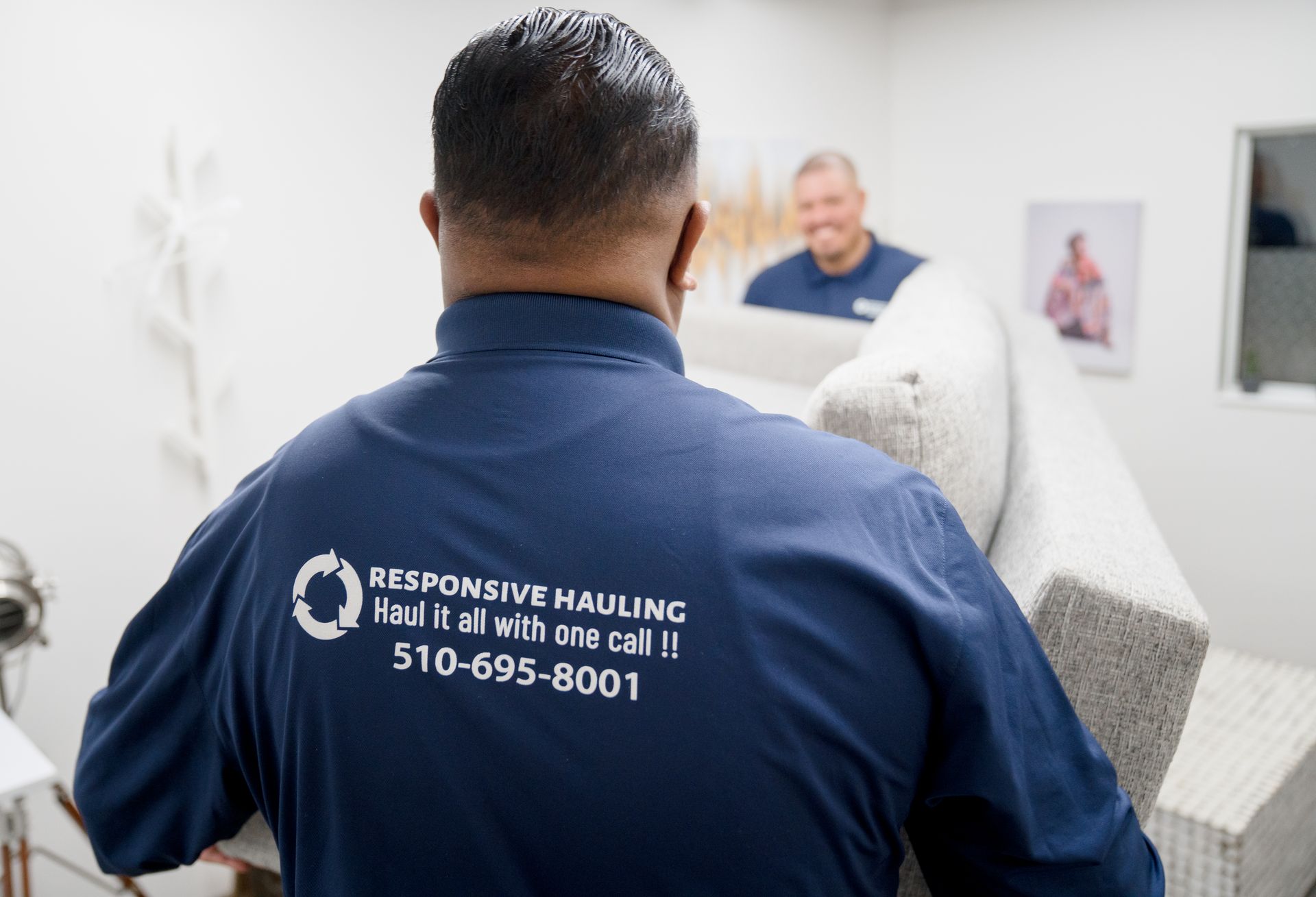 Company logo printed on the back of the shirt.