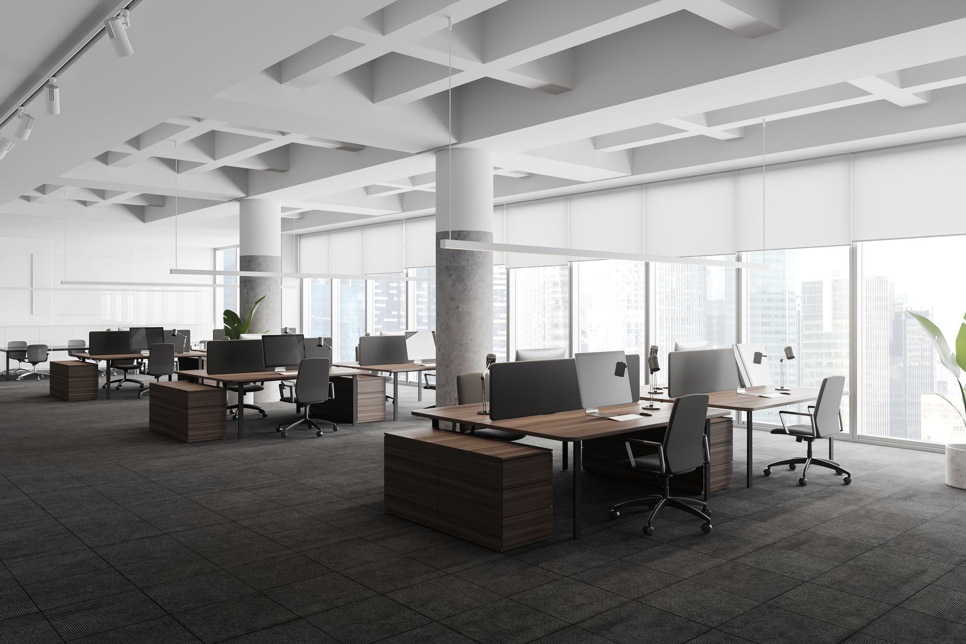 An empty office with a lot of windows and desks and chairs.