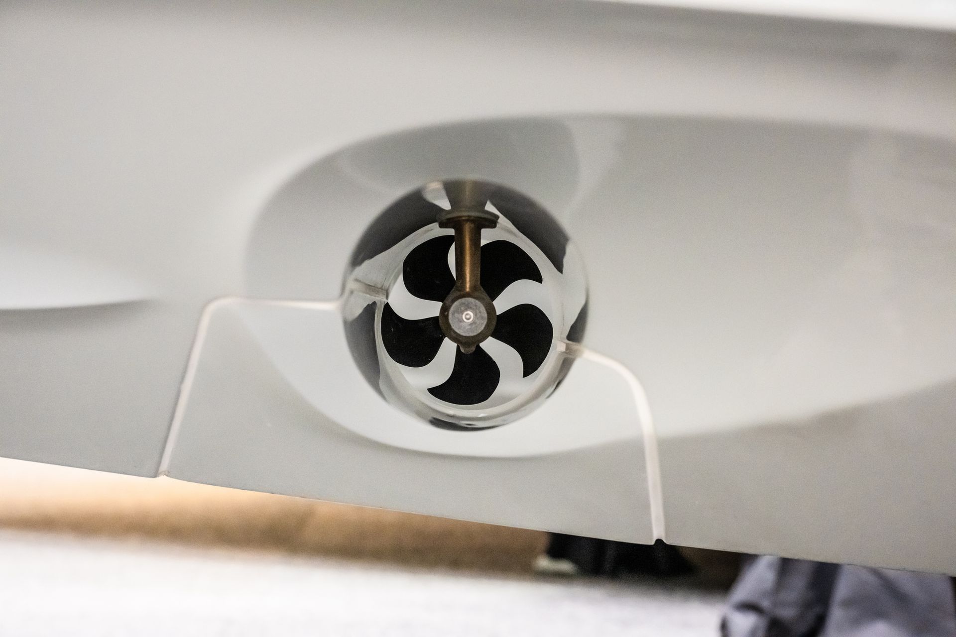 Bow thruster on a white boat.