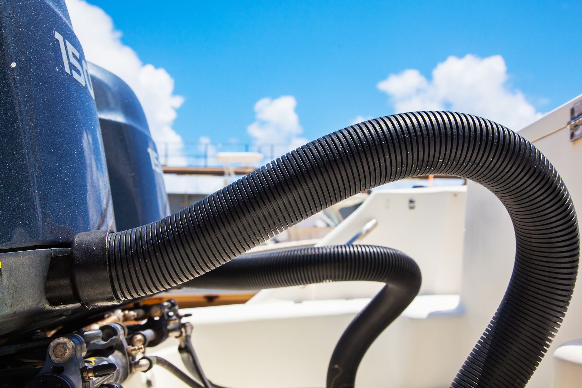 Marine exhaust systems on motorboat stern with visible outboard motors and exhaust outlets. Marine exhaust systems on motorboat stern with visible outboard motors and exhaust outlets.