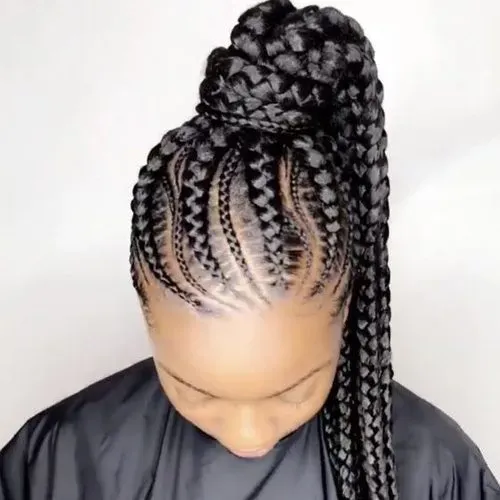 Woman with dark skin, wearing cornrow braids styled in a high ponytail.