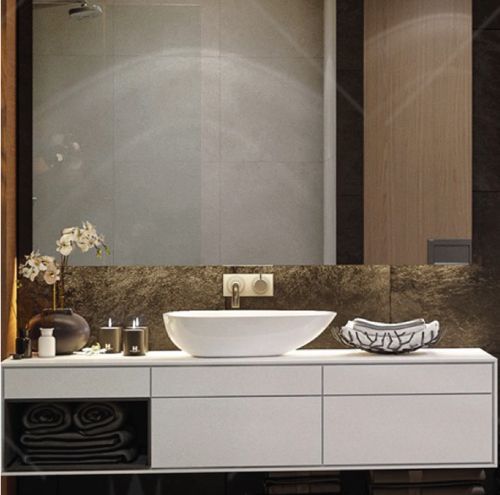 A bathroom with a sink and a large mirror.