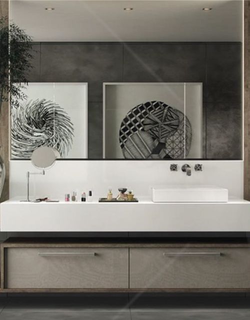 A bathroom with a sink and a large mirror