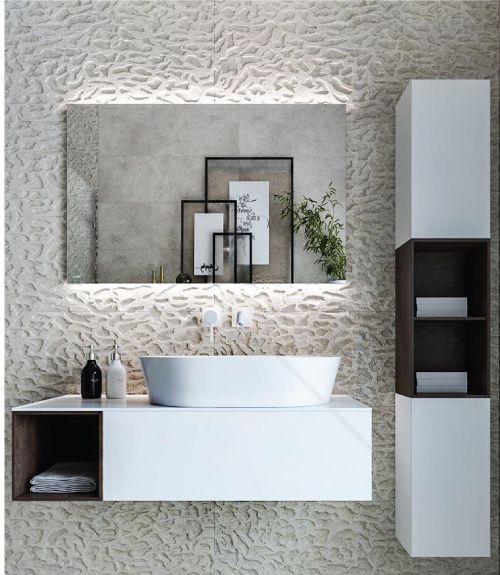 A bathroom with a sink and a large mirror