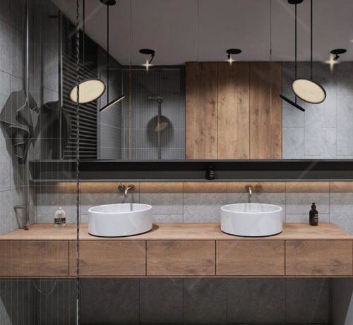 A bathroom with two sinks and a large mirror.