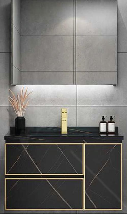 A bathroom with a sink , mirror and cabinets.