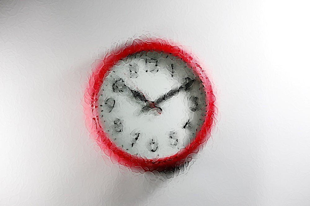 red wall clock with a Florielle design