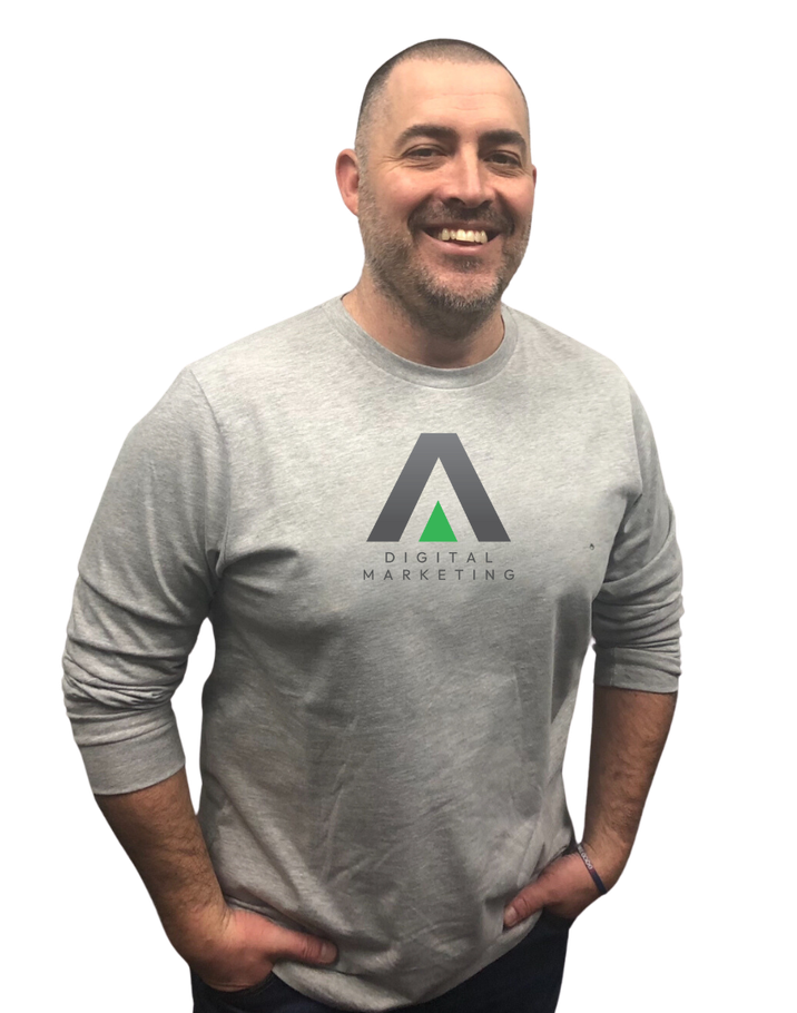 A man with a beard is wearing a black t-shirt