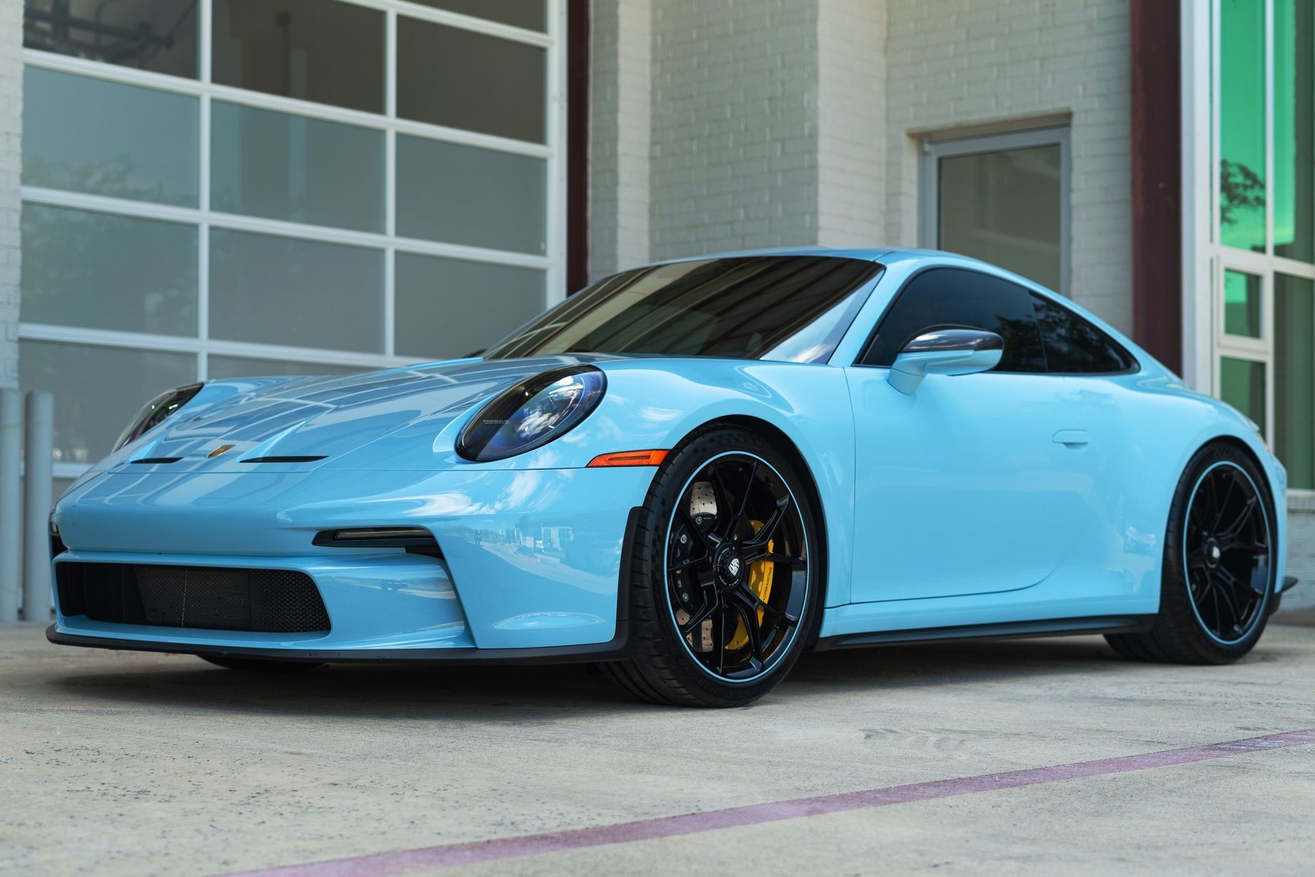 parked blue car with window tint