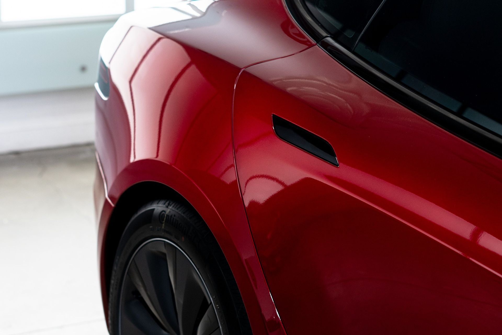 red car with ceramic coating, glass ceramic coating and wheel faces ceramic coating