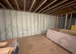 A room under construction with a lot of insulation on the walls.