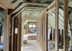 A long hallway in a house under construction.