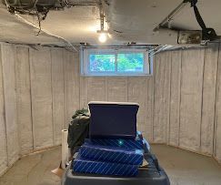 A garage filled with boxes and a window.