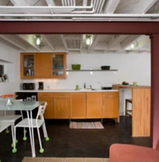 A kitchen with a table and chairs in it