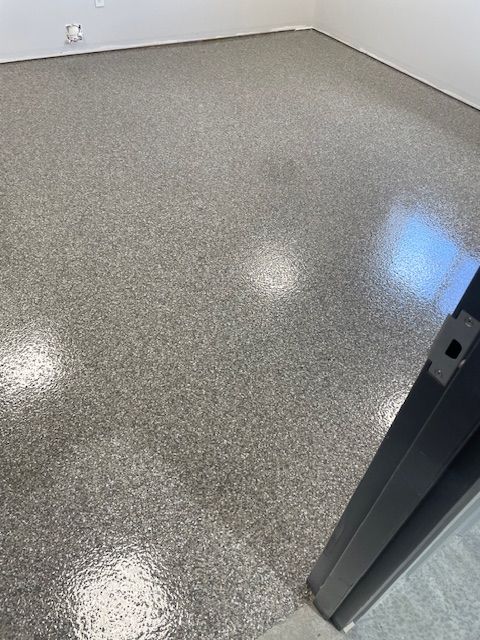 A room with a shiny floor and a door.