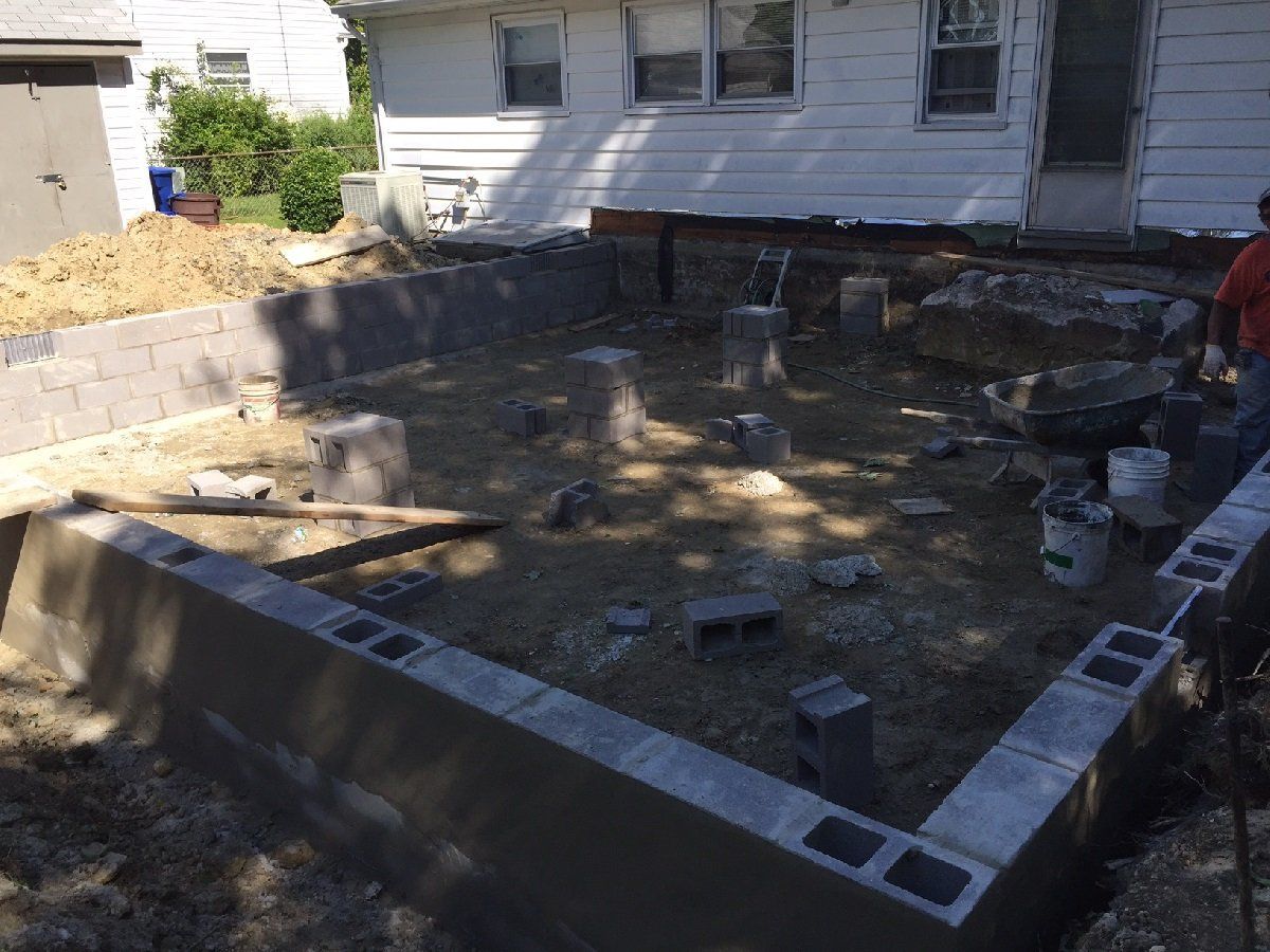 Construction Worker Builds Brick Wall — Cinnaminson, NJ — A & M Masonry and Concrete