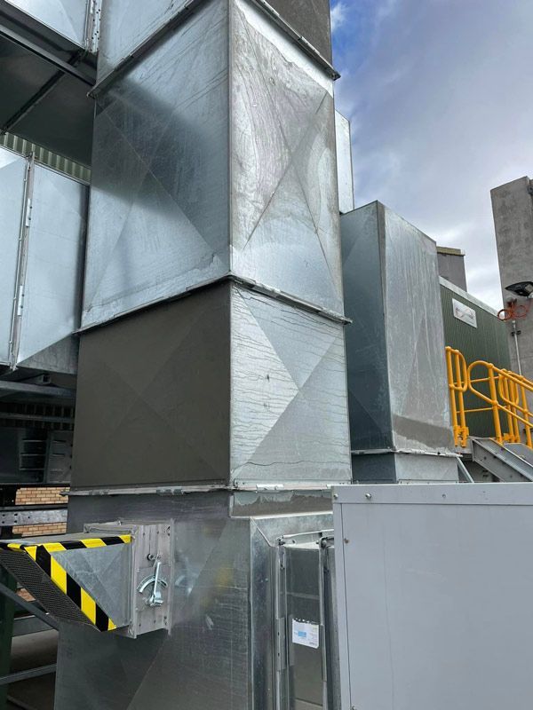 A building with a lot of metal pipes coming out of it — Industrial Air Conditioning Hunter Valley