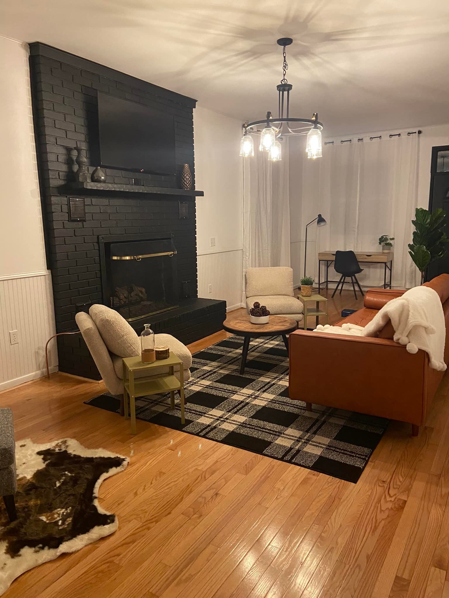 a living room under construction with a lot of tools on the floor .