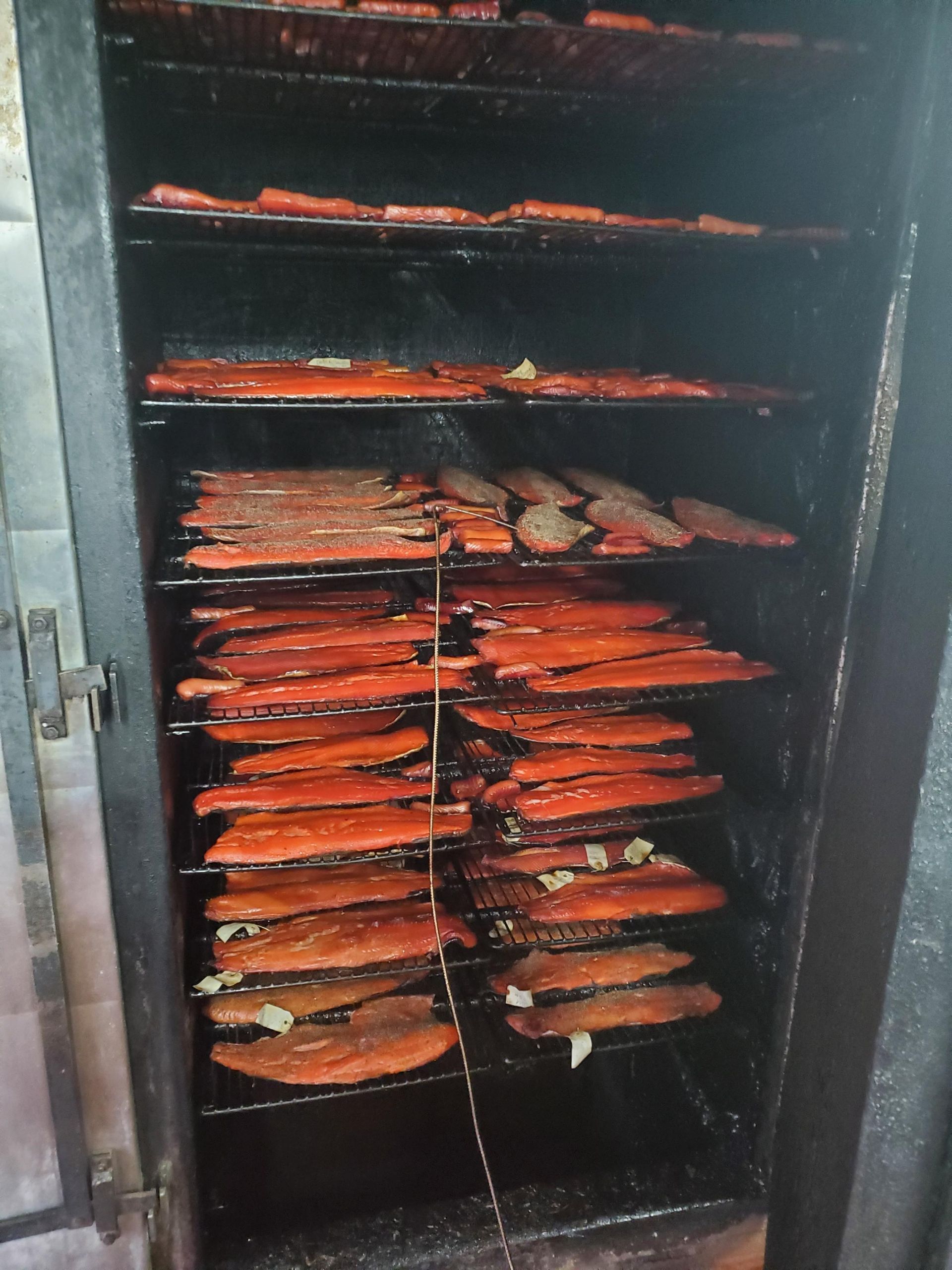 Man Showing the Smoked Products — Port Angeles WA — Sunrise Meats