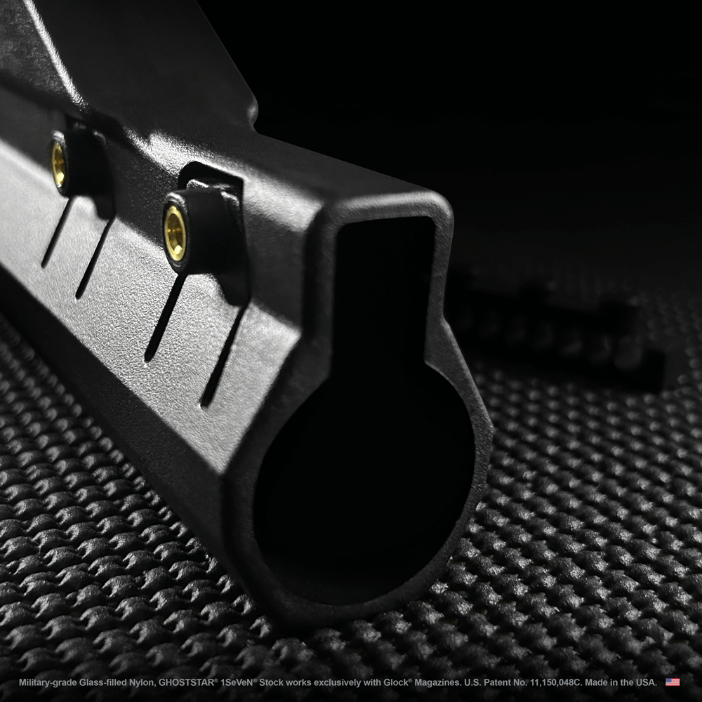 A close up of a black object on a black surface