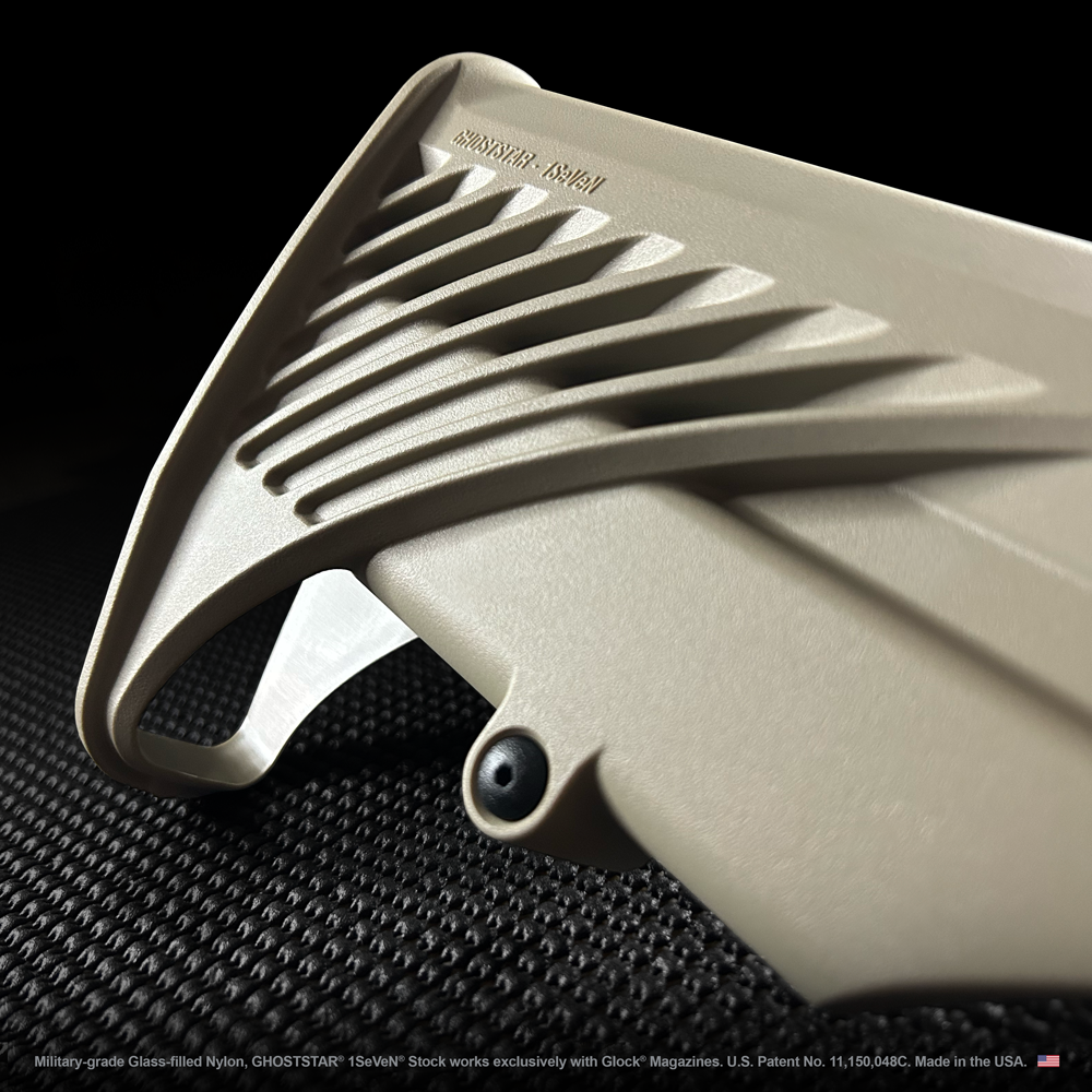 A close up of a tan colored item with a black background