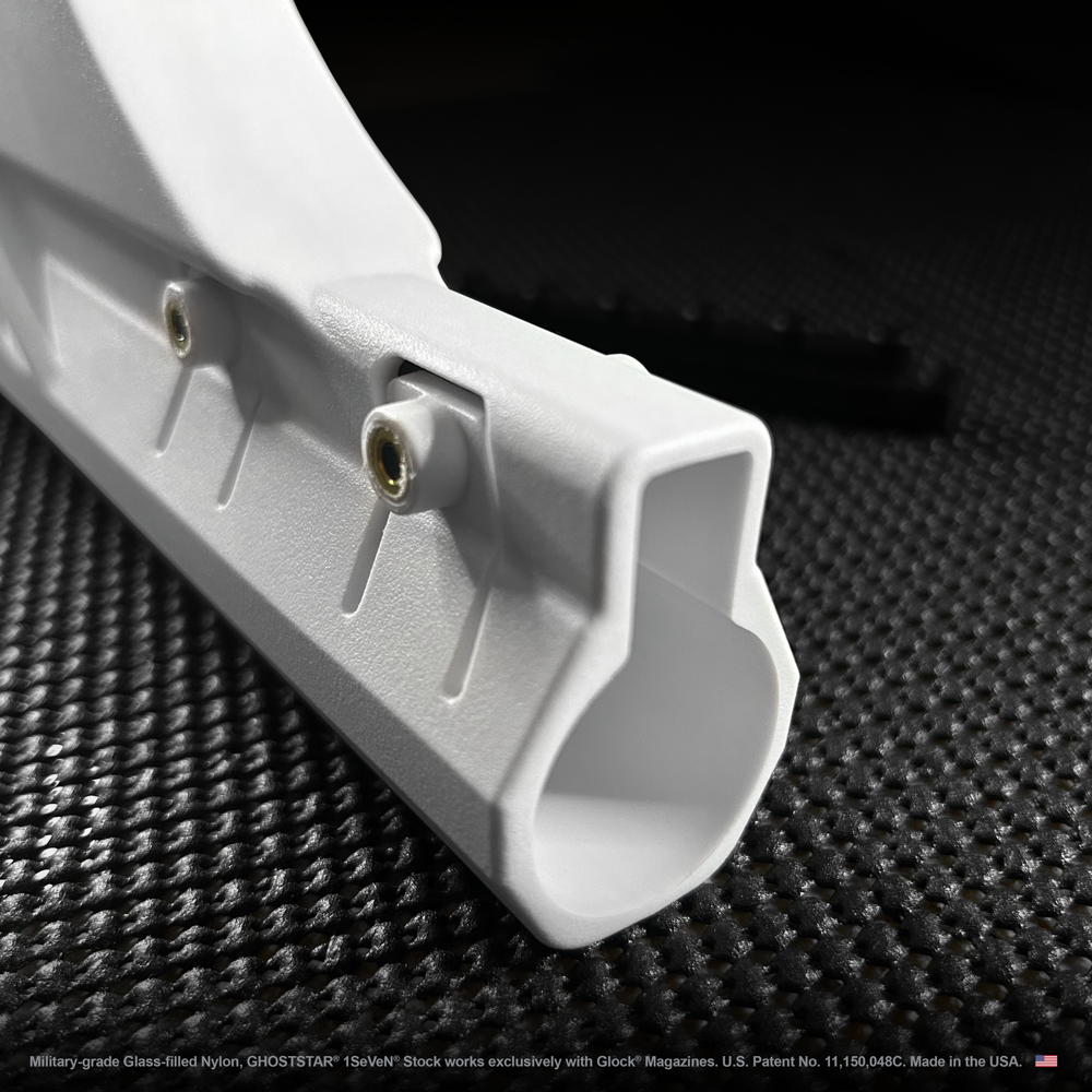 A close up of a white object on a black surface