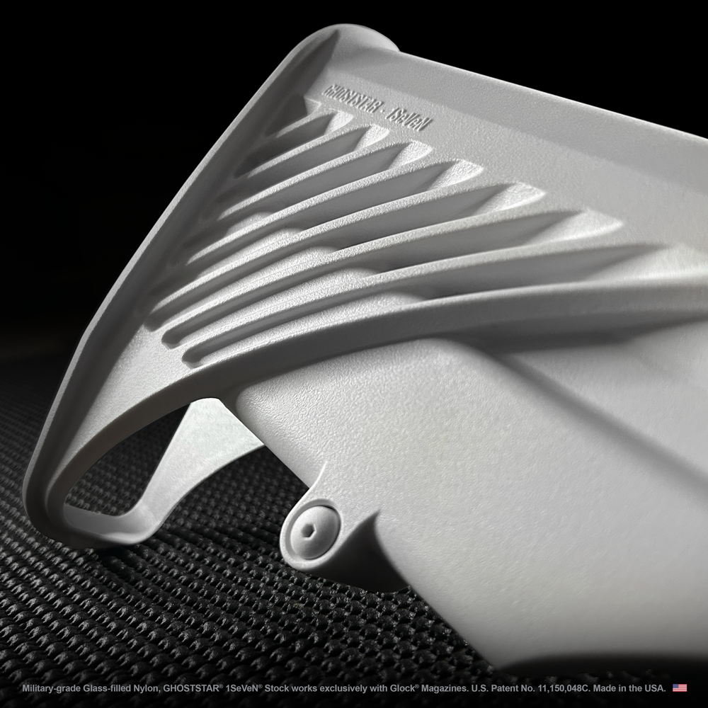 A close up of a white object on a black surface