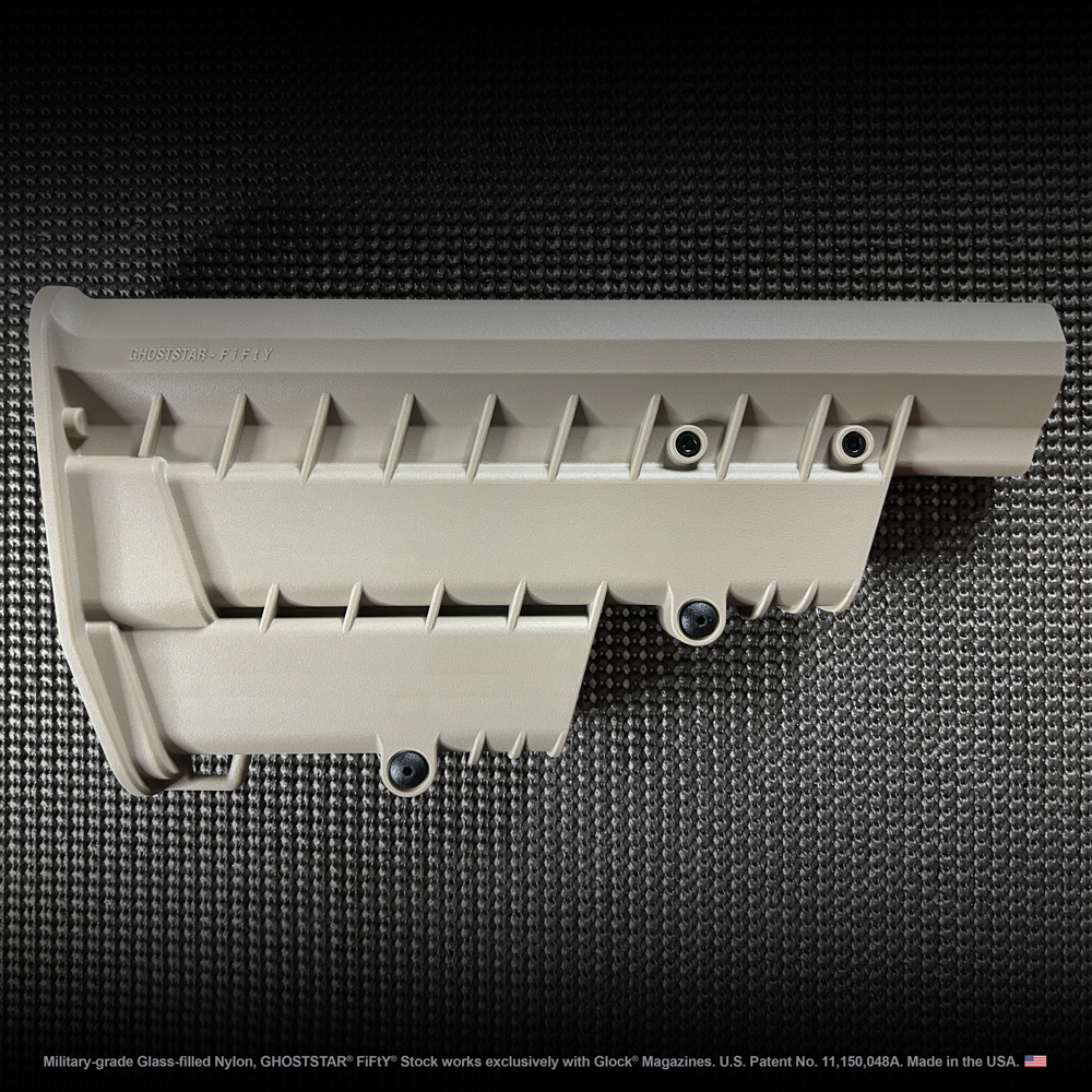 A white plastic item is sitting on a black surface.