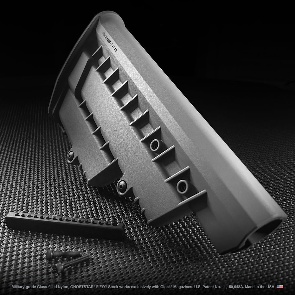 A black and white photo of a gray item that says ' precision usa ' on it