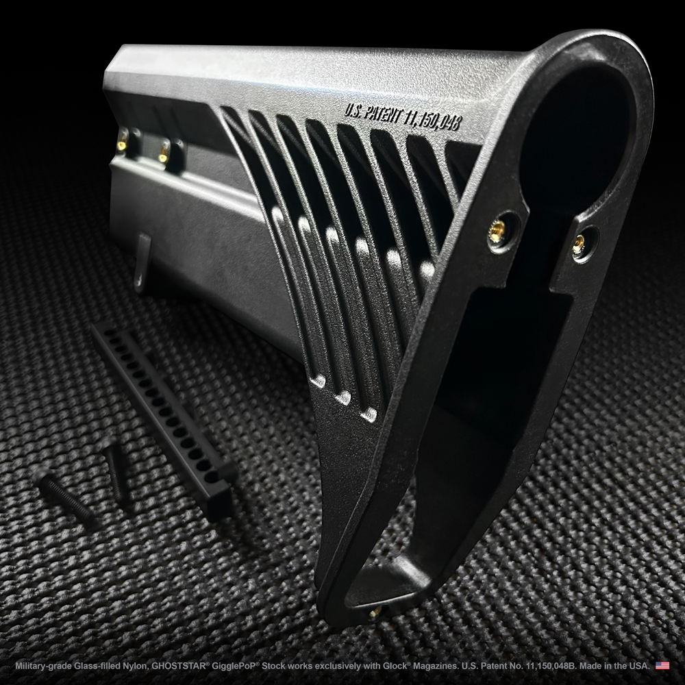 A close up of a black item with the letters s.l. on it