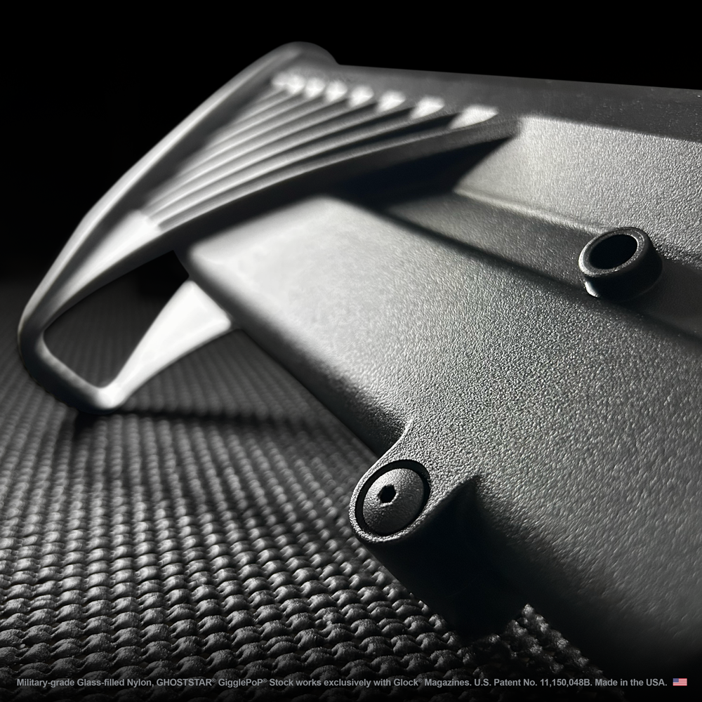 A close up of a black object on a black surface