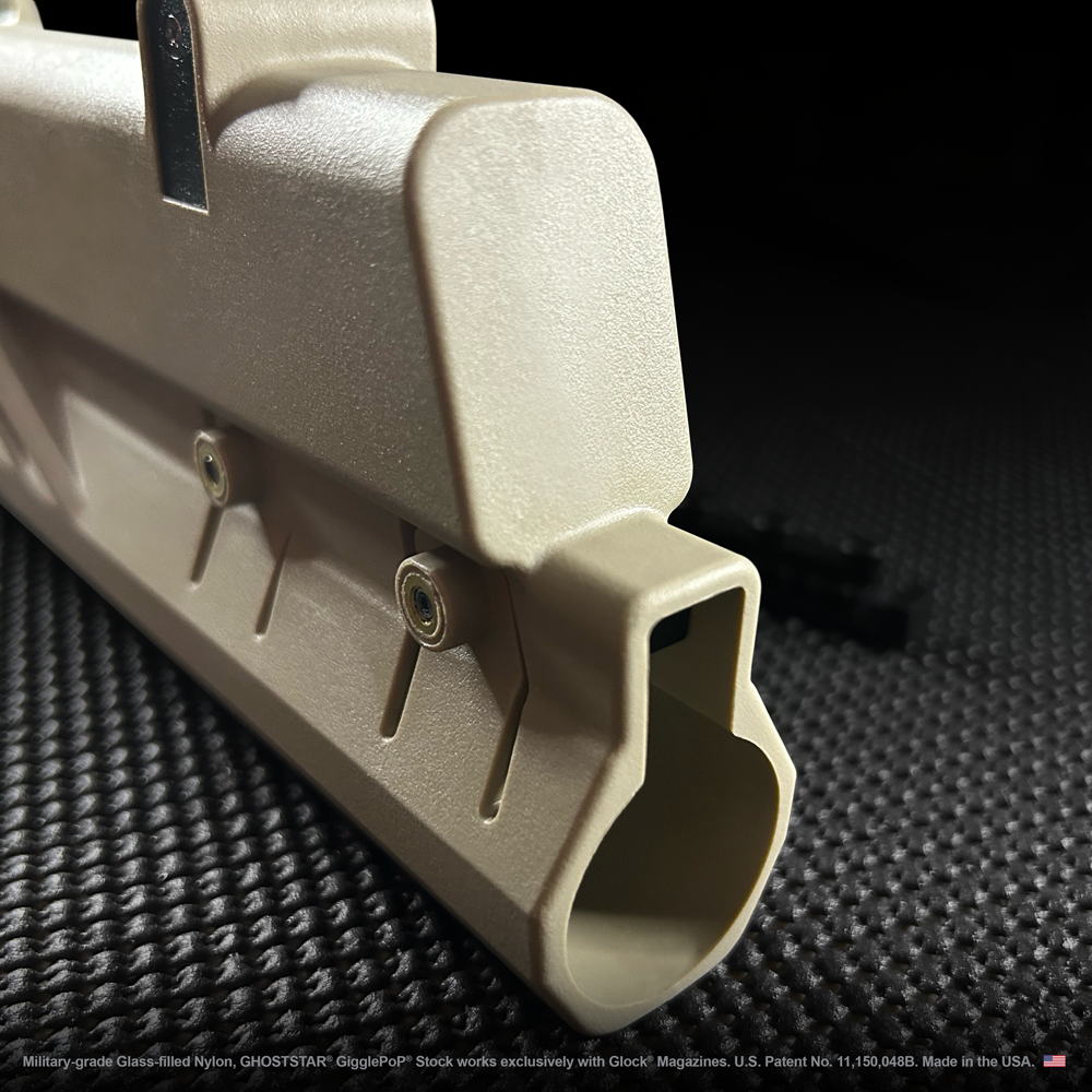 A close up of a tan colored object with a black background