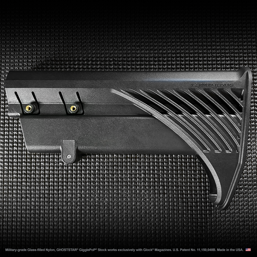 A close up of a black item with a screw on it