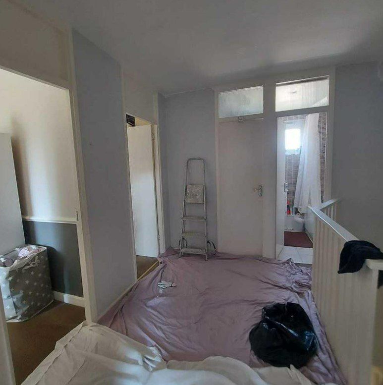 Picture of a landing being redecorated in white by painters and decorators Liverpool