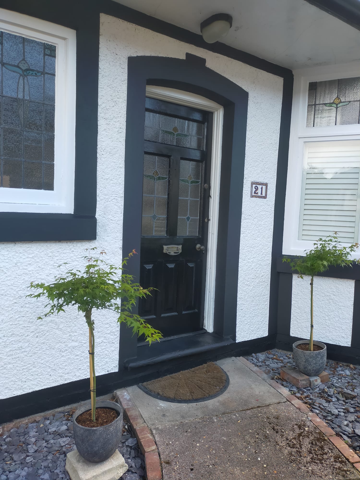 Picture of a rendered house which has been newly painted in brilliant white by Painters and Decorators Birmingham