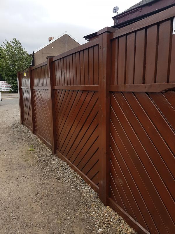 Painters and Decorators Liverpool - wooden fence painted brown