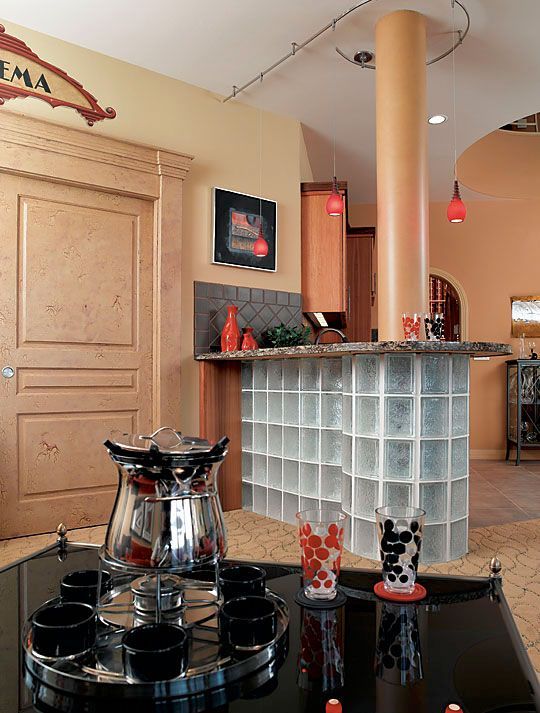 A kitchen with a sign on the wall that says cinema