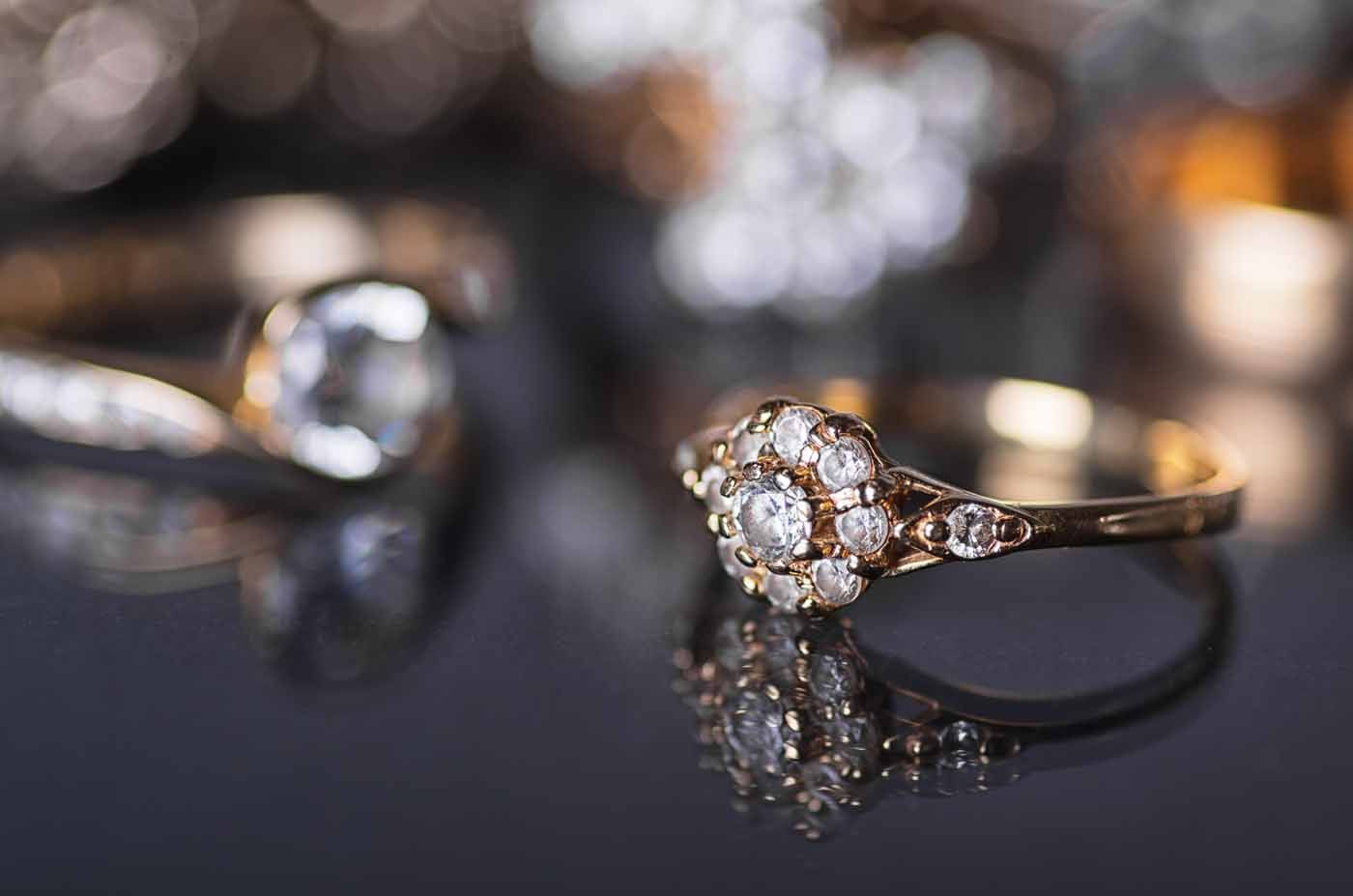 A close up of a diamond ring on a table.