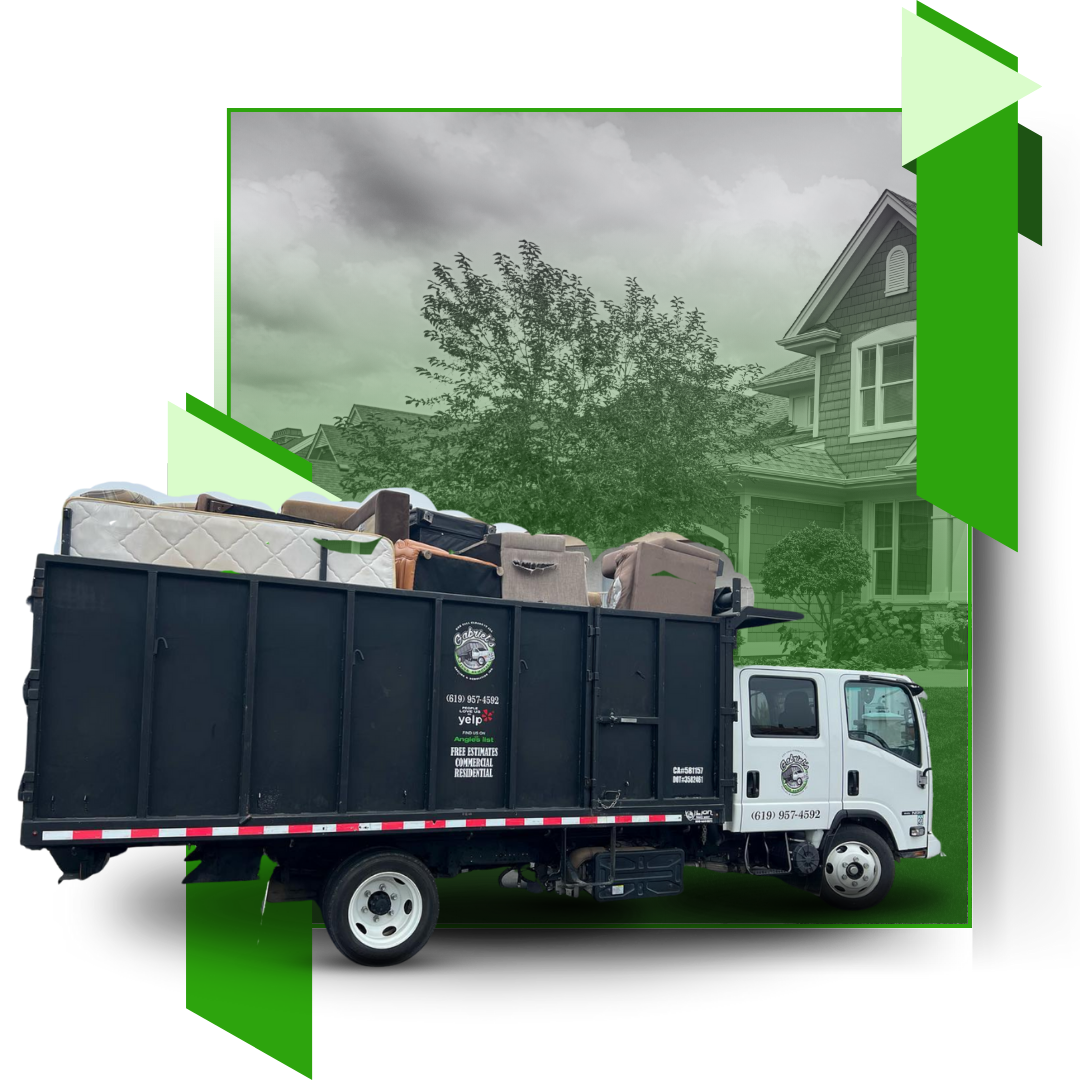 A dump truck filled with junk is parked in front of a house.