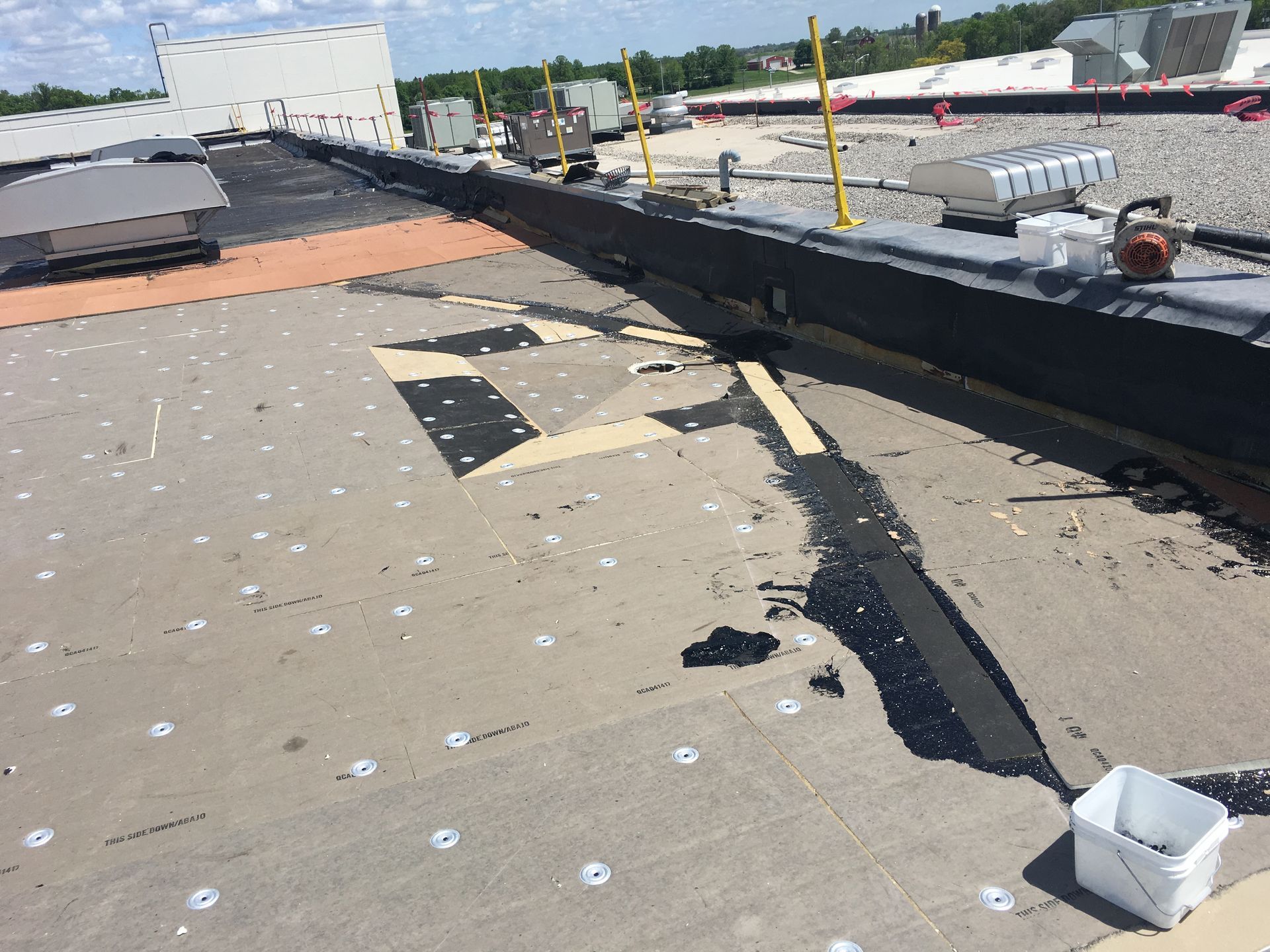 Workers On A Rooftop — Seymour, WI — Northeastern Roofing Company