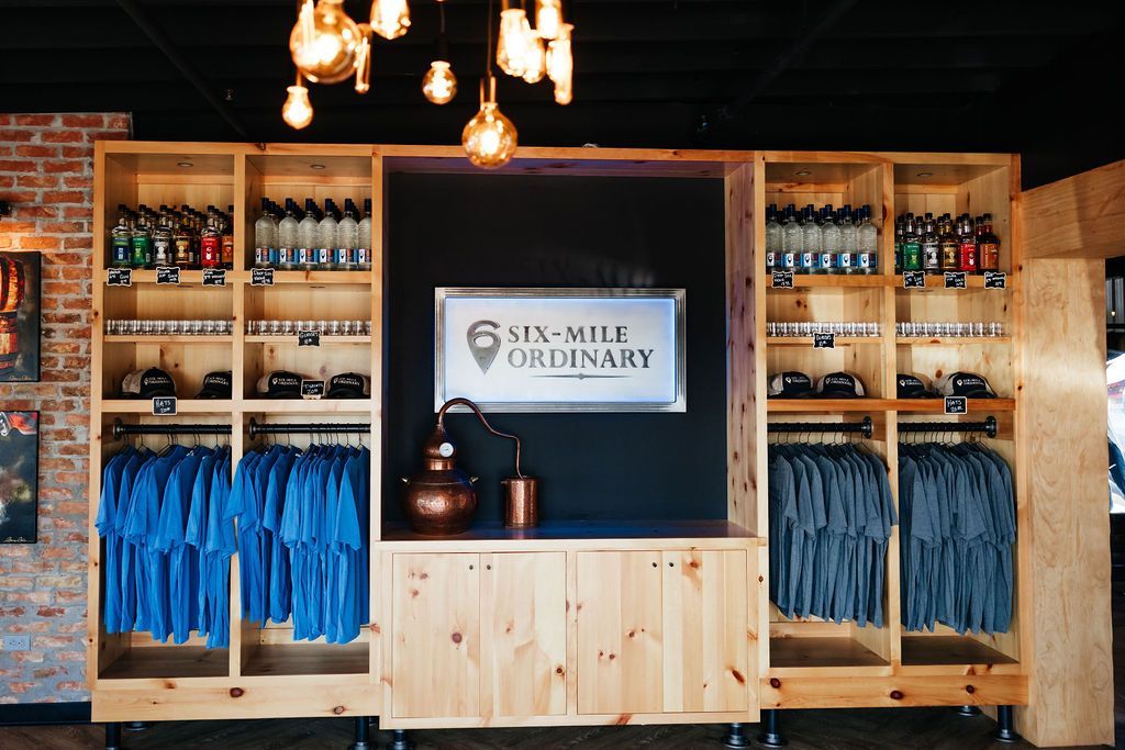 The Merch Section at Six-Mile Ordinary in Columbia, MO Selling T-Shirts & More