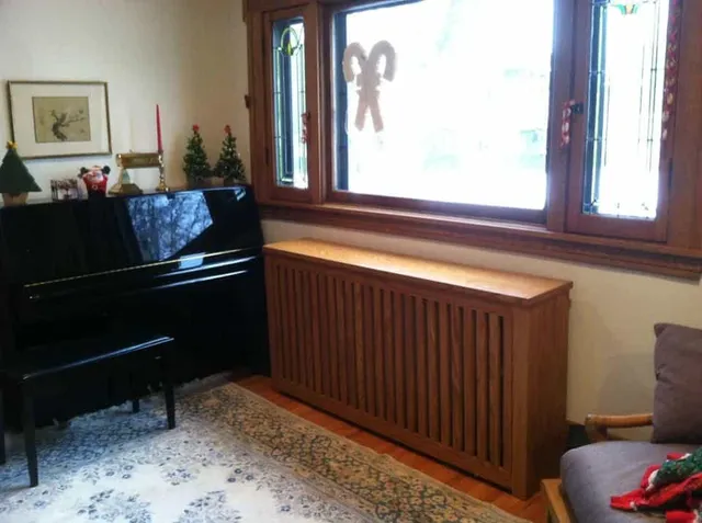 Small Storage With Radiation Cover Beside A Piano — Minneapolis, MN — Craftsman Radiator Covers