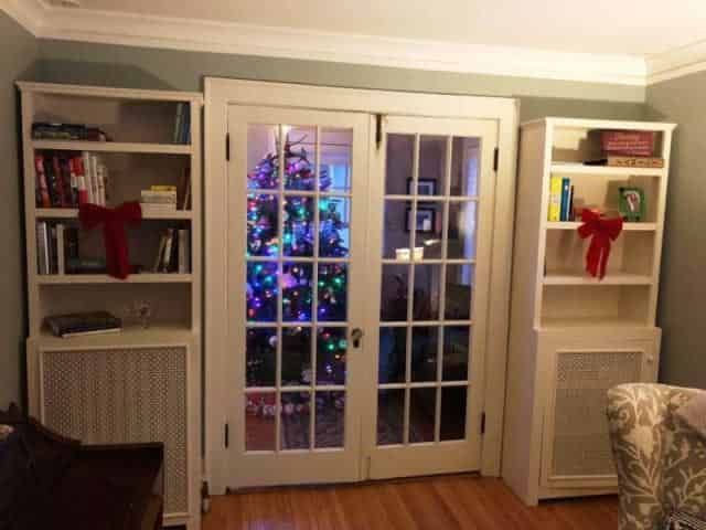 White Cabinet With Radiator Covers Beside A Door — Minneapolis, MN — Craftsman Radiator Covers