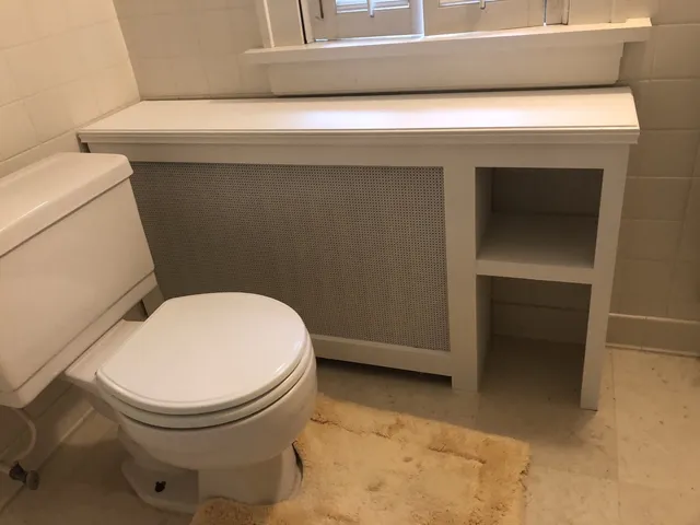 Radiator Cabinet Beside A Bathroom Bowl — Minneapolis, MN — Craftsman Radiator Covers