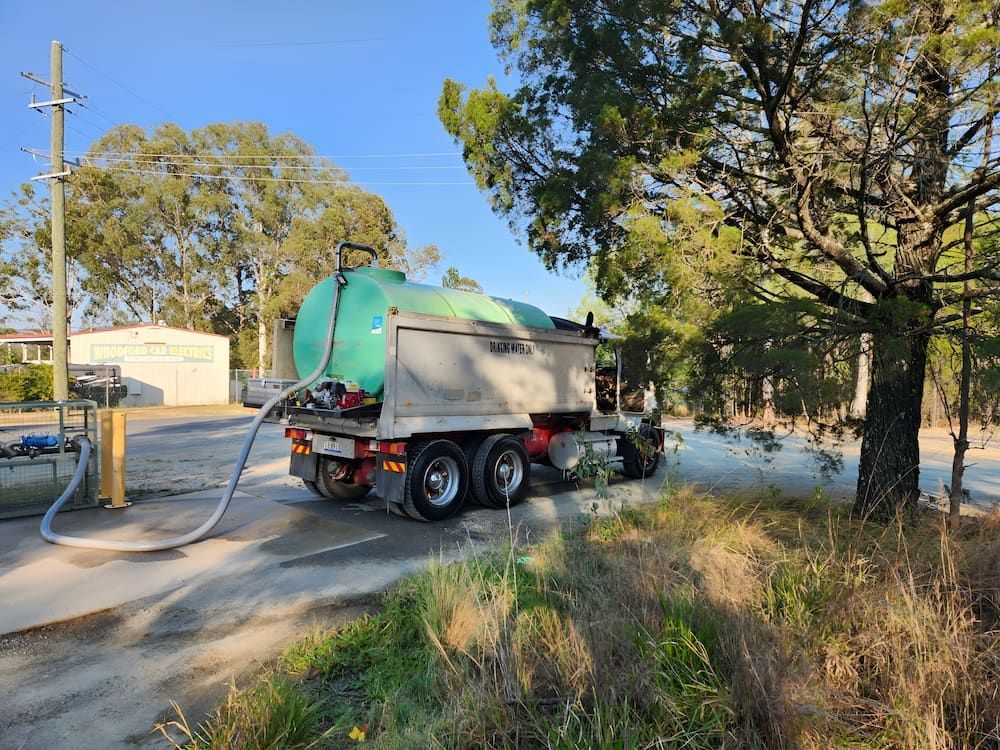 A Water Truck Is Parked On The Side Of The Road — LTR Water Deliveries In Wamuran, QLD