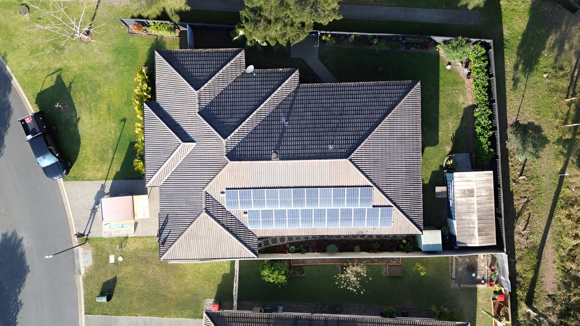 Overhead View of A House with Solar Panels on Its Roof — Geoff Hall Roofing in Laurieton, NSW
