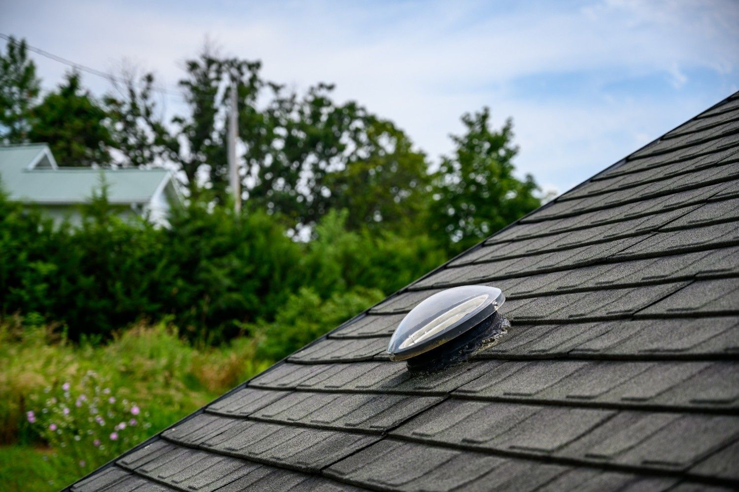 Dark Shingled Roof with A Solar Tubes — Geoff Hall Roofing in South West Rocks, NSW